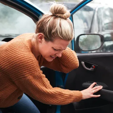 Woman In Car Accident With Whiplash Pain